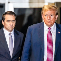 Todd Blanche and Donald Trump speak to the media