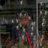 Bullet holes in the window of the store