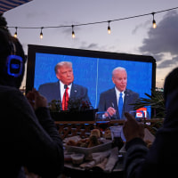 Diners at a tavern in San Diego watch Donald Trump and Joe Biden in a presidential debate on Oct. 22, 2020. 
