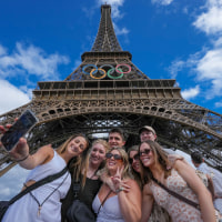 The logo of the Olympic Games on display at the Eiffel Tower