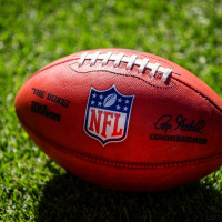 A close up view of a Wilson The Duke game football on the field during the second quarter of a game between the Denver Broncos and the Washington Commanders at Empower Field at Mile High on September 17, 2023 in Denver, Colorado. 