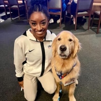 US Olympic gymnastics therapy dog Beacon hospitalized with serious symptoms