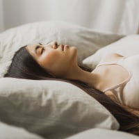 Woman laying in bed