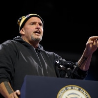 Sen. John Fetterman, D-Pa., speaks during a campaign event in Erie, Pa, on Oct. 14, 2024.