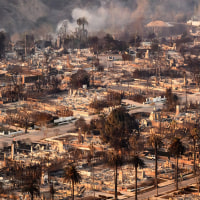 Image: aerial homes destroyed  smoke smolder 