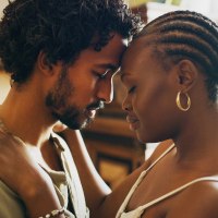 Shot of a young couple standing together and sharing an intimate moment at home.