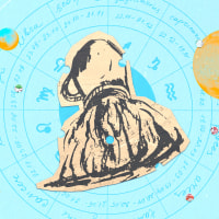 Paper cutout of an Aquarius zodiac on a blue background
