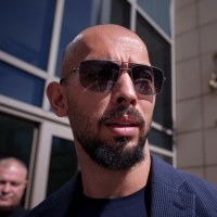 Andrew Tate speaks to media after exiting the Bucharest Tribunal, in Bucharest, Romania, on Sept. 26, 2023. 