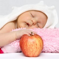 Baby with apple