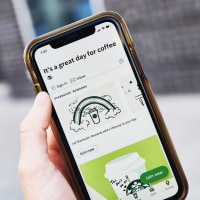 The home screen for the Starbucks app displayed on a smartphone.