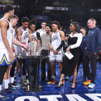 Team C receives the championship trophy during the Castrol Rising Stars Game