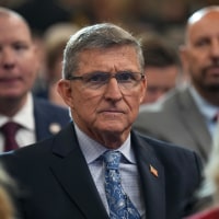 Former National Security Advisor Michael Flynn looks on before President Donald Trump delivers remarks at the Justice Department