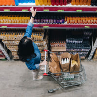 Woman reaching at store