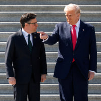 Donald Trump and House Speaker Mike Johnson speaking on the steps of the Capitol