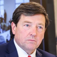 Edward Martin listening during a meeting