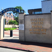 The John Barry Gate at the United States Naval Academy campus, outside on a sunny day