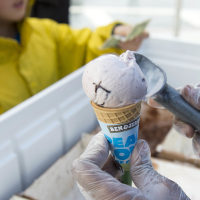 Ben & Jerry's scoops ice cream into a cone 
