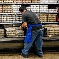 Johnny Ximenez works to tidy the egg section at Kroger on North Shepherd Drive in the Heights on Thursday, Nov. 14, 2024, in Houston. 