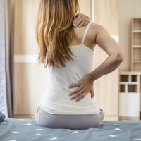 Woman suffering from back ache