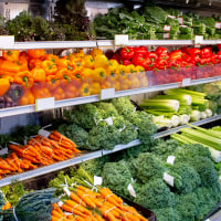 A view of a fresh vegetable display at a local grocery store.