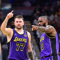 Luka Doncic and LeBron James during a Los Angeles Lakers v Indiana Pacers basketball game.
