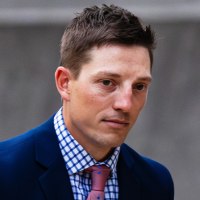 Former Grand Rapids Police officer Christopher Schurr enters the Kent County Courthouse in Grand Rapids, Mich., on May 2, 2025. 