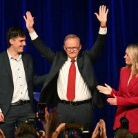 Australia's Prime Minister Anthony Albanese celebrates with his partner Jodie Haydon and son Nathan Albanese 