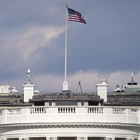 A split composite image of Stephanie Ruhle, left, and The White House exterior with a flag on the roof.