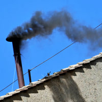 Black smoke rising from the chimney of the Sistine Chapel signalling that cardinals failed to elect a new pope during their conclave in the Vatican