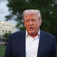President Donald Trump speaks to reporters on the south lawn of the White House