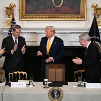 Attendees applaud Donald Trump