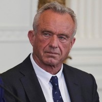 Health and Human Services Secretary Robert F. Kennedy Jr. listens as President Donald Trump speaks