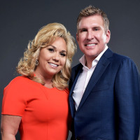 Julie and Todd Chrisley  pose for a portrait.