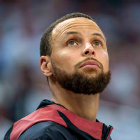 May 8, 2025; Minneapolis, Minnesota, USA; Golden State Warriors guard Stephen Curry (30) looks on from the bench against the Minnesota Timberwolves in the second half during game two of the second round for the 2025 NBA Playoffs at Target Center. Mandatory Credit: Jesse Johnson-Imagn Images
