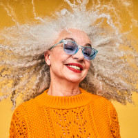 Colourful studio portrait of a senior woman