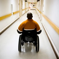 A veteran in a wheelchair in the hallway of the Veterans Affairs Medical Center in Washington