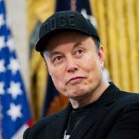 Elon Musk looks on during a news conference with President Donald Trump in the Oval Office on May 30, 2025.