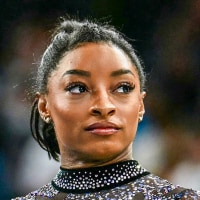 A split composite of Riley Gaines and Simone Biles.