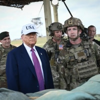 President Donald Trump watches a military demonstration at Fort Bragg in North Carolina on June 10, 2025. 