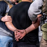 ICE agents carry out raid.