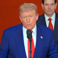 Trump addresses the nation from a lectern at the White House.