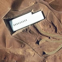 A uranium enrichment site amidst mountains and roads. 