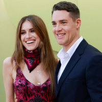 US actress Allison Williams and German actor Alexander Dreymon arrive for the Versace Fall/Winter 2023 fashion show on March 9, 2023, at the Pacific Design Center in West Hollywood, California. 