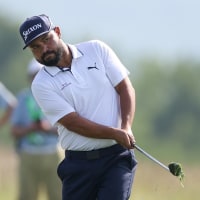 Jun 12, 2025; Oakmont, Pennsylvania, USA; JJ Spaun chips onto the 17th green  during the first round of the U.S. Open golf tournament. Mandatory Credit: Bill Streicher-Imagn Images