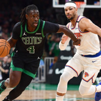 May 14, 2025; Boston, Massachusetts, USA; Boston Celtics guard Jrue Holiday (4) controls the ball while New York Knicks guard Josh Hart (3) defends in the second half during game five of the second round for the 2025 NBA Playoffs at TD Garden. Mandatory Credit: Bob DeChiara-Imagn Images