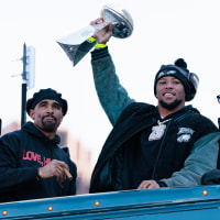 Feb 14, 2025; Philadelphia, PA, USA; Philadelphia Eagles running back Saquon Barkley (26) lifts the Lombardi Trophy during the Super Bowl LIX championship parade and rally. Mandatory Credit: Caean Couto-Imagn Images
