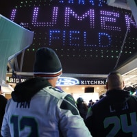 SEATTLE, WASHINGTON - DECEMBER 15: Fans look on during a halftime drone show performance during an NFL game between the Green Bay Packers and Seattle Seahawks at Lumen Field on December 15, 2024 in Seattle, Washington. (Photo by Steph Chambers/Getty Images)