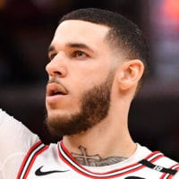 Feb 28, 2025; Chicago, Illinois, USA; Chicago Bulls forward Lonzo Ball (2) hits a three point shot against Toronto Raptors guard Jamal Shead (23) during overtime at the United Center. Mandatory Credit: Patrick Gorski-Imagn Images