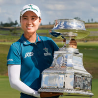 Jun 22, 2025; Frisco, Texas, USA; Minjee Lee poses with the winner's trophy following the final round of the KPMG Women's PGA Championship. Mandatory Credit: Raymond Carlin III-Imagn Images