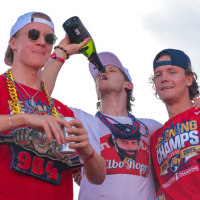 Jun 22, 2025; Fort Lauderdale, Florida, UNITED STATES; Florida Panthers center Anton Lundell (left), center Eetu Luostarinen (center) and center Jesper Boqvist (right) celebrate on stage during the Stanley Cup championship parade and rally. Mandatory Credit: Sam Navarro-Imagn Images